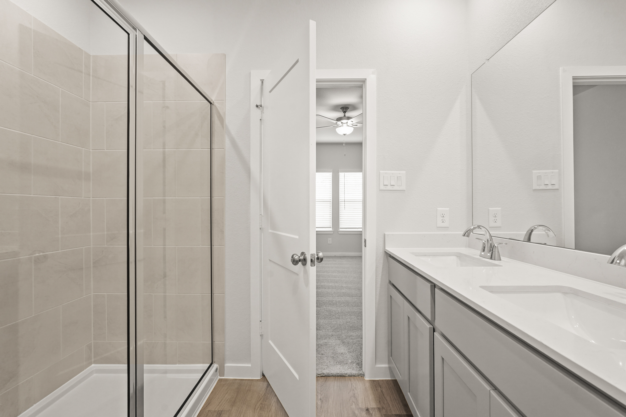 A bathroom with a glass shower.