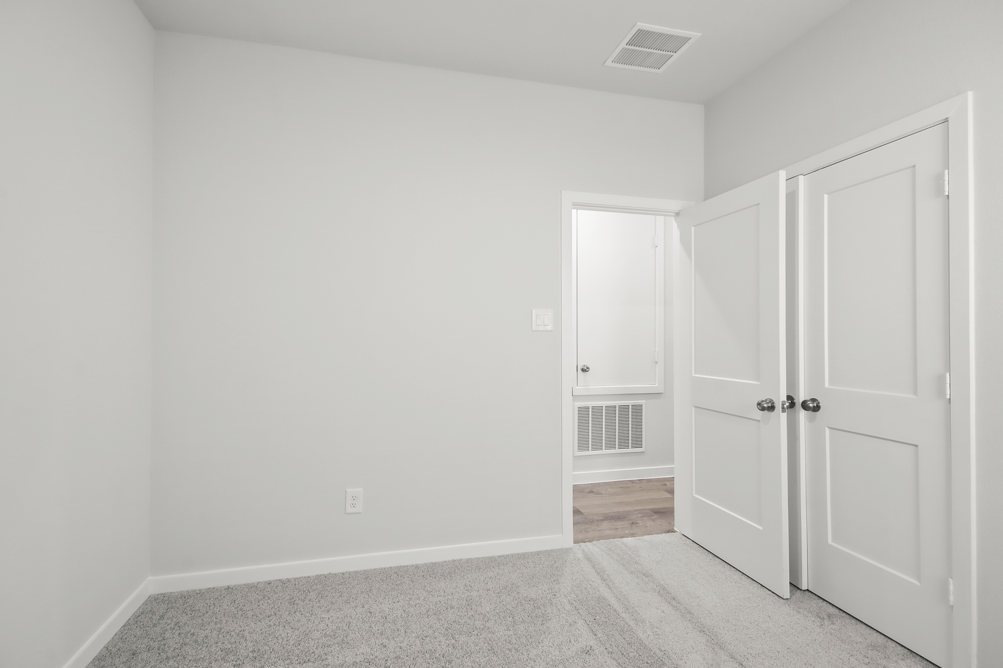 A room with white doors.