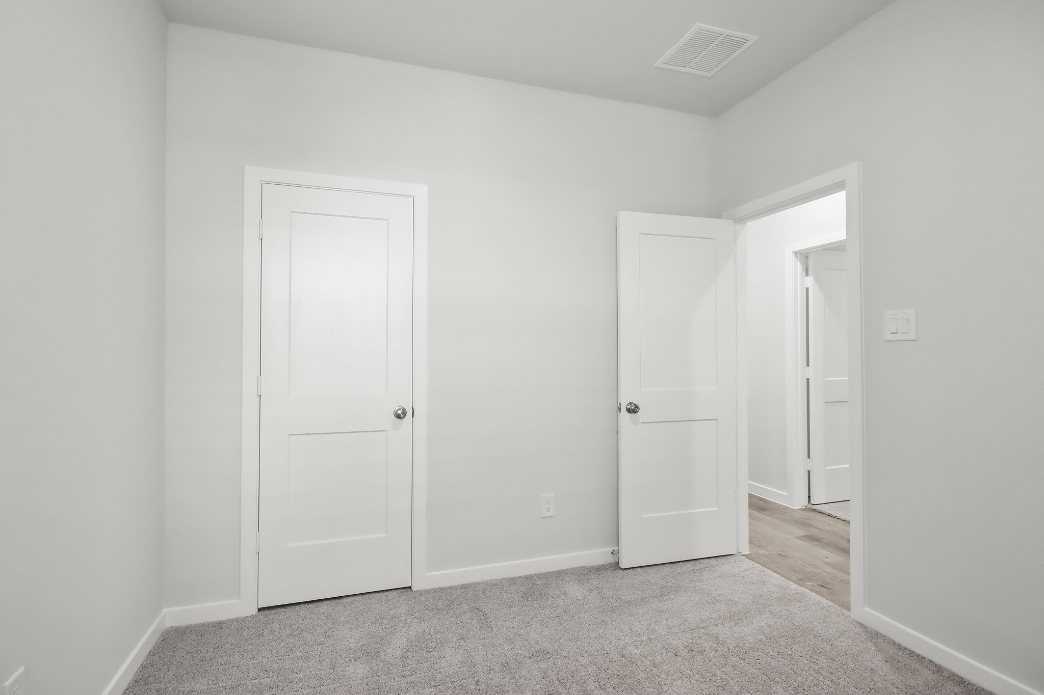 A room with white doors.