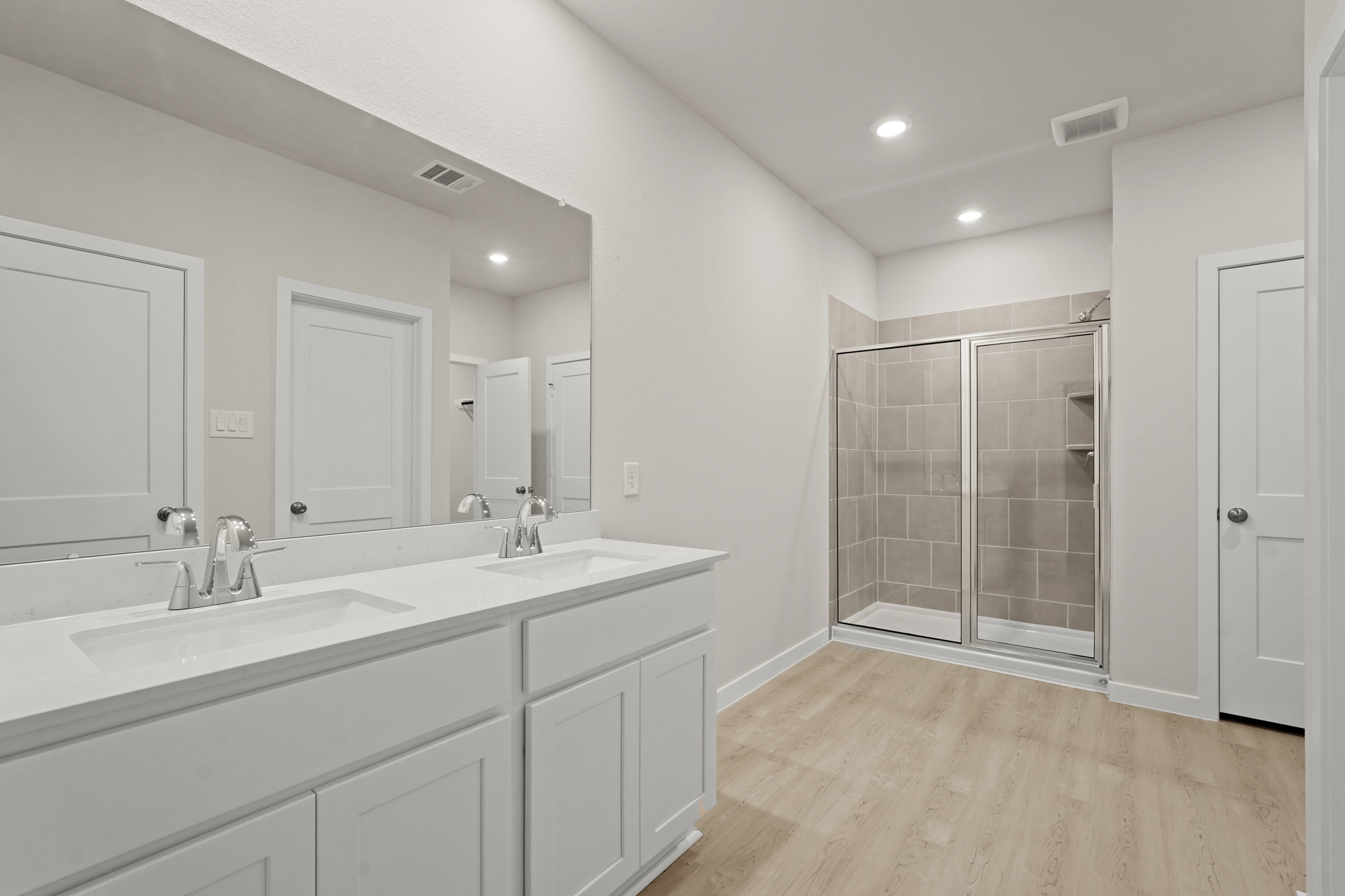 A bathroom with a glass shower.