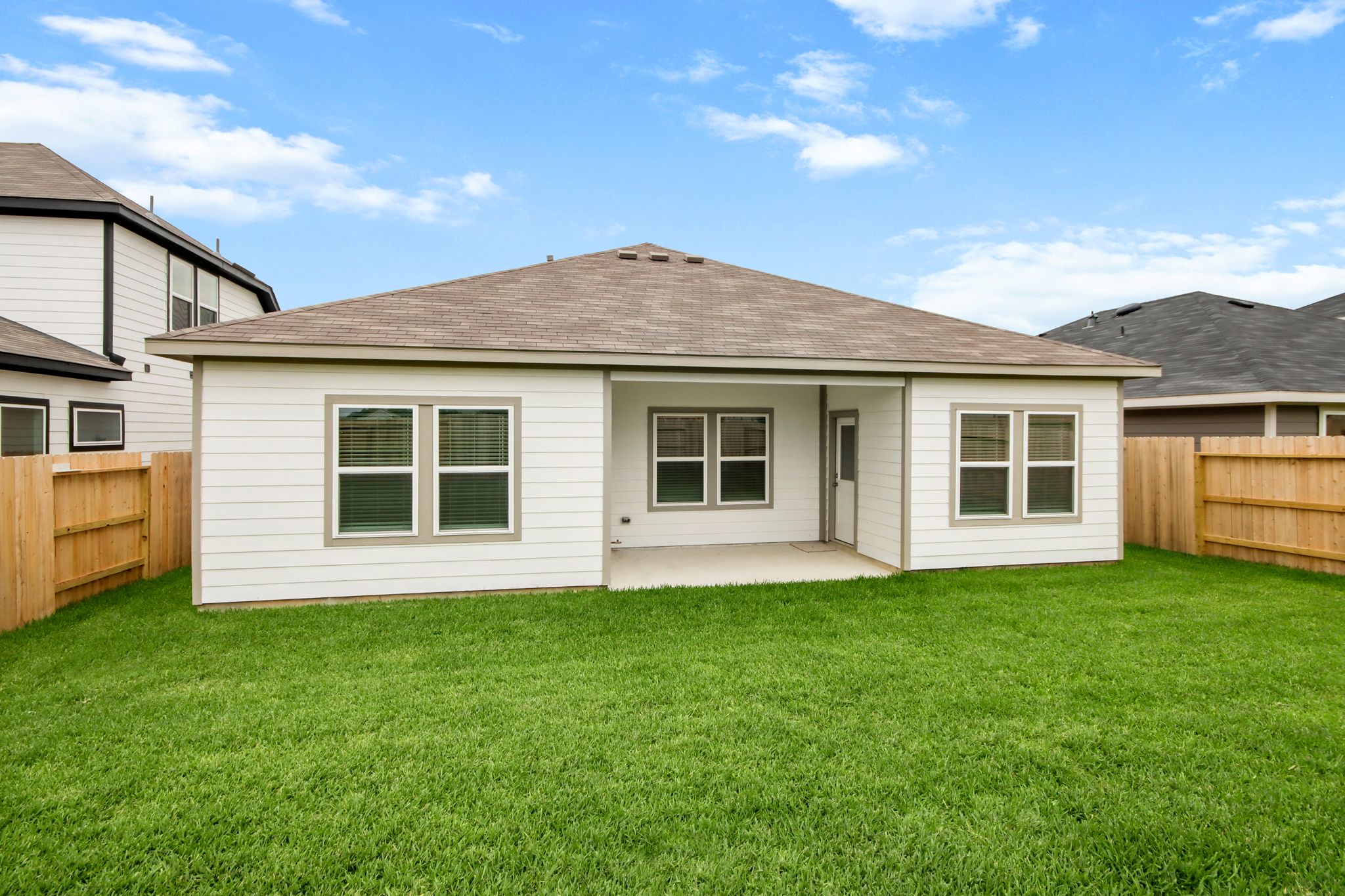 A house with a grass yard.