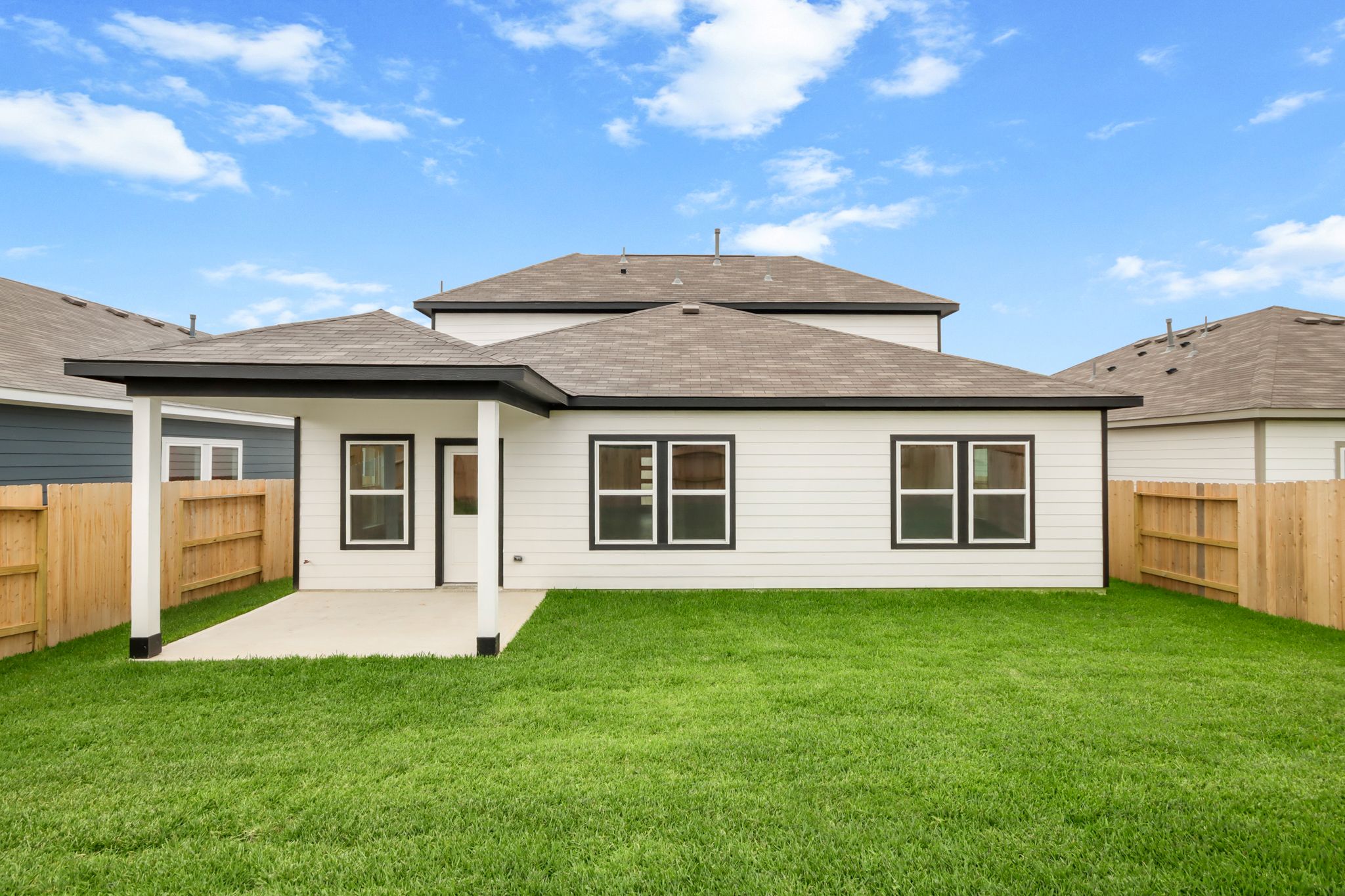 A house with a grass yard.