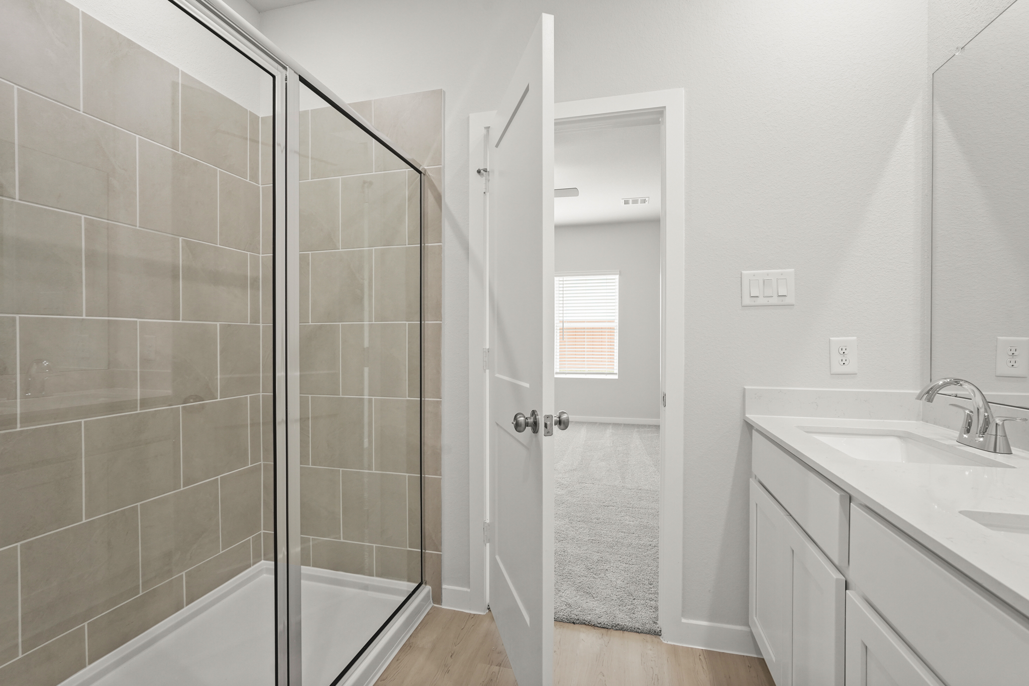 A bathroom with a glass shower.