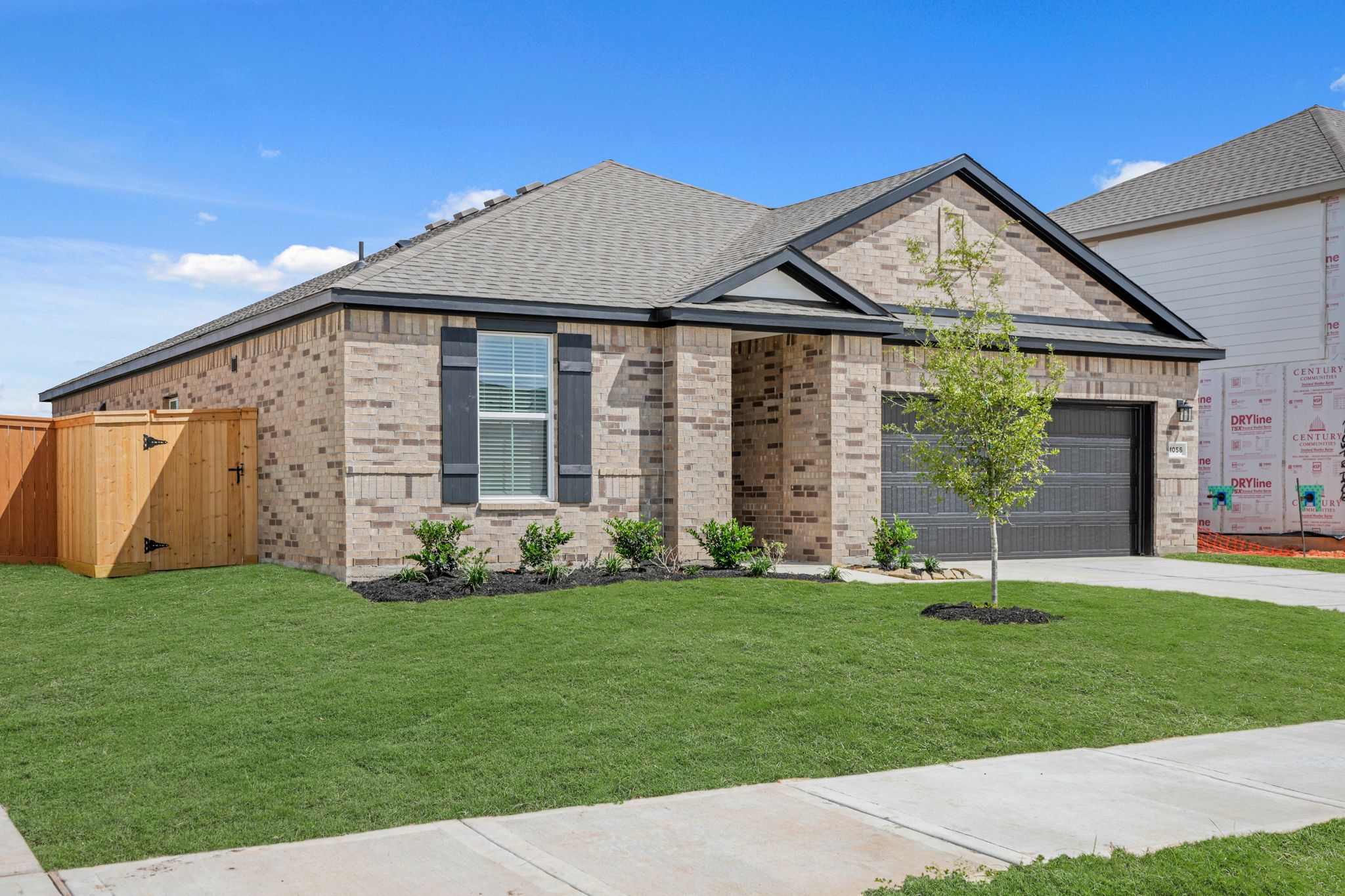 A house with a green lawn.