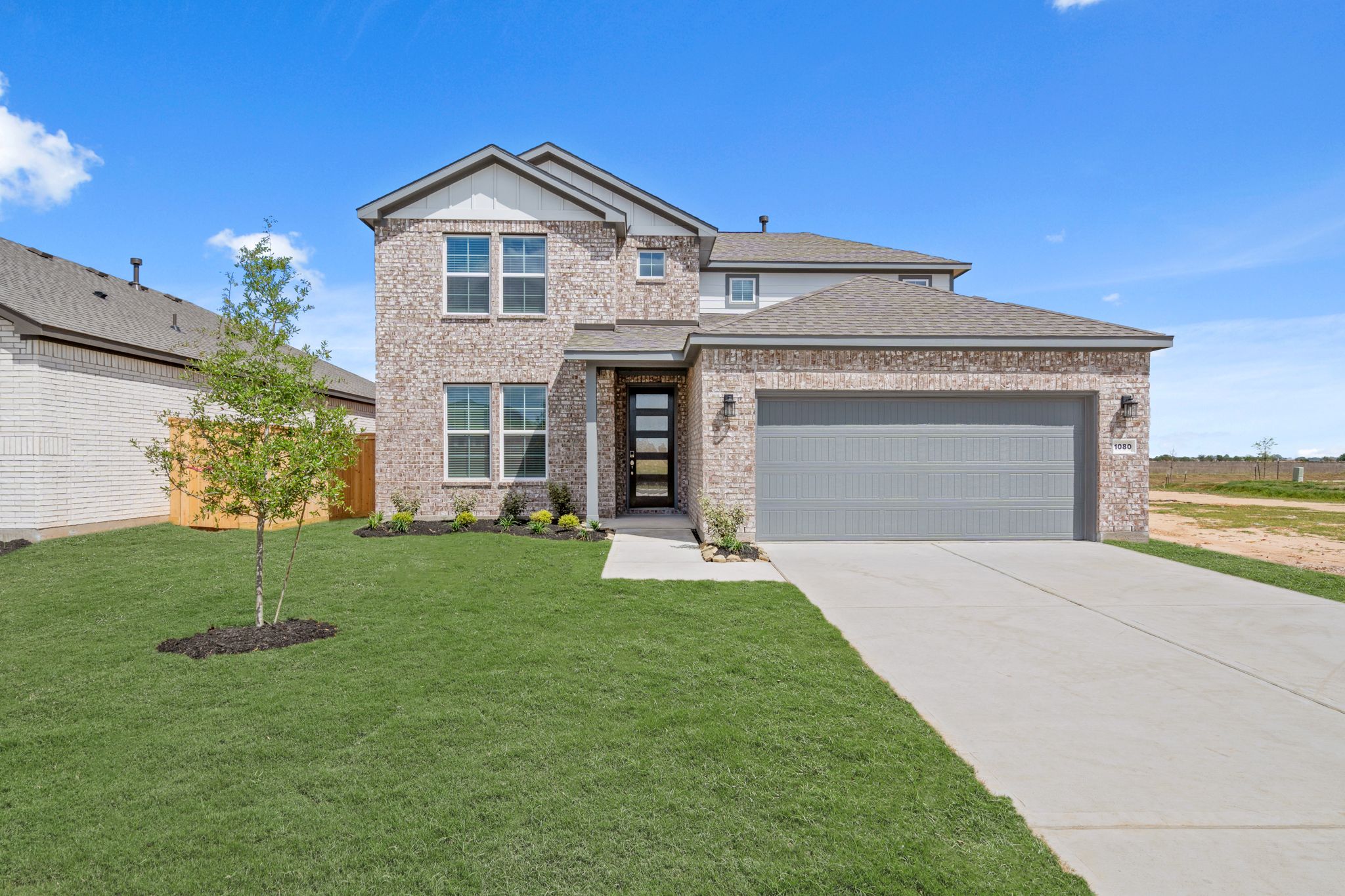 A house with a large front yard.