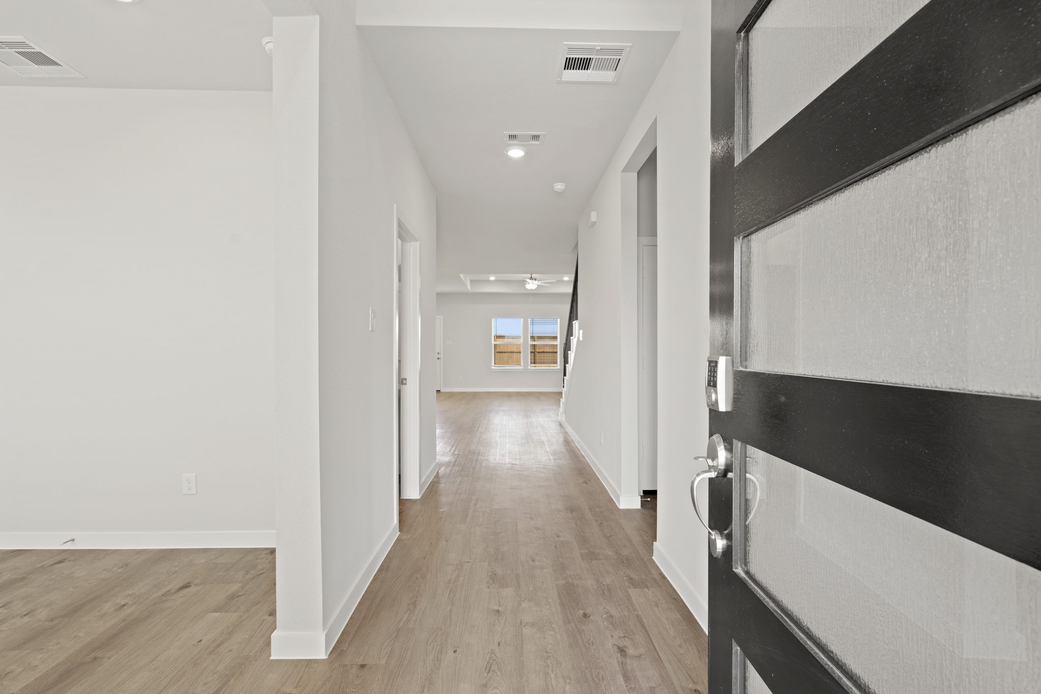 A hallway with white walls.