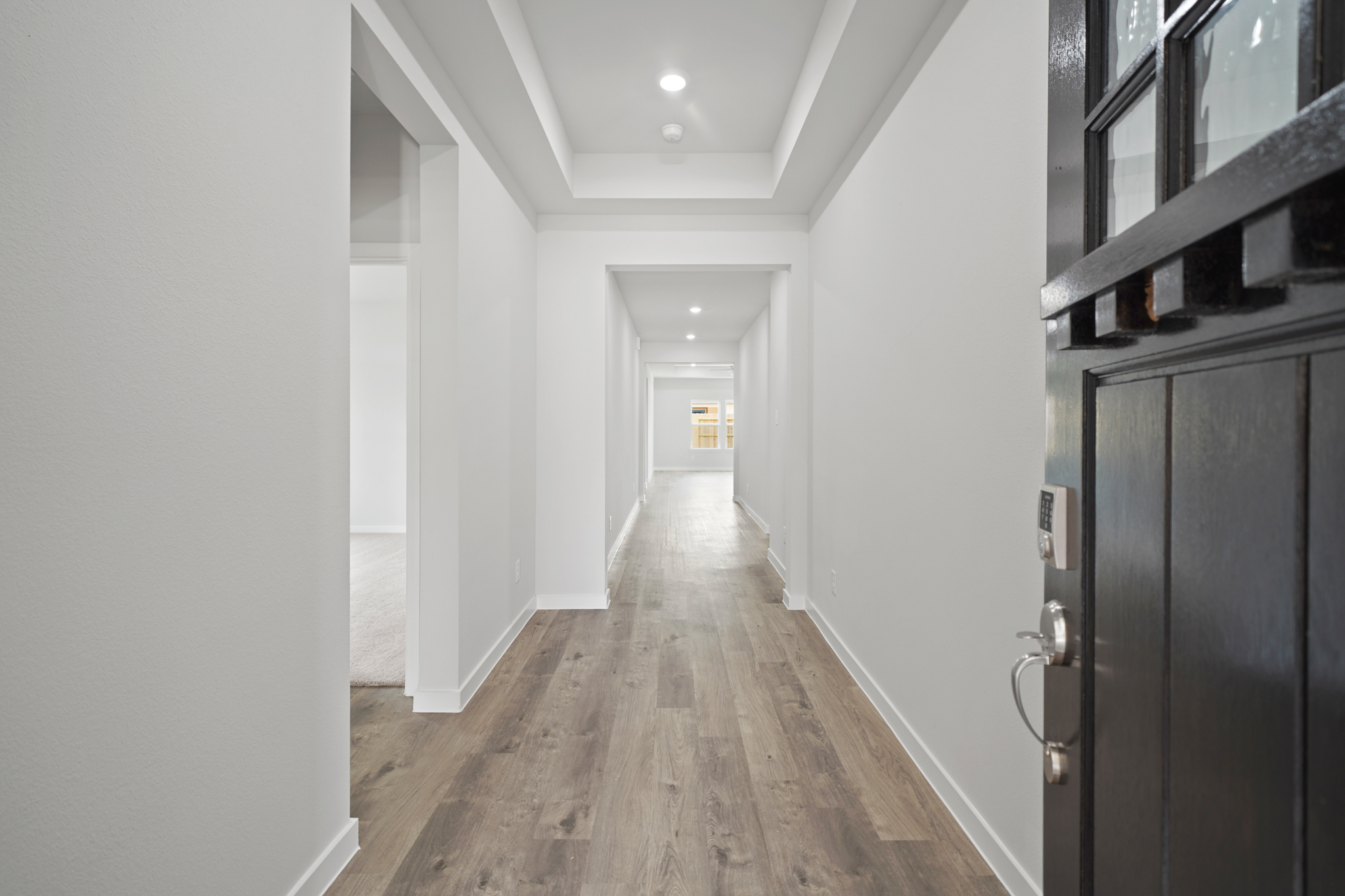 A hallway with white walls.