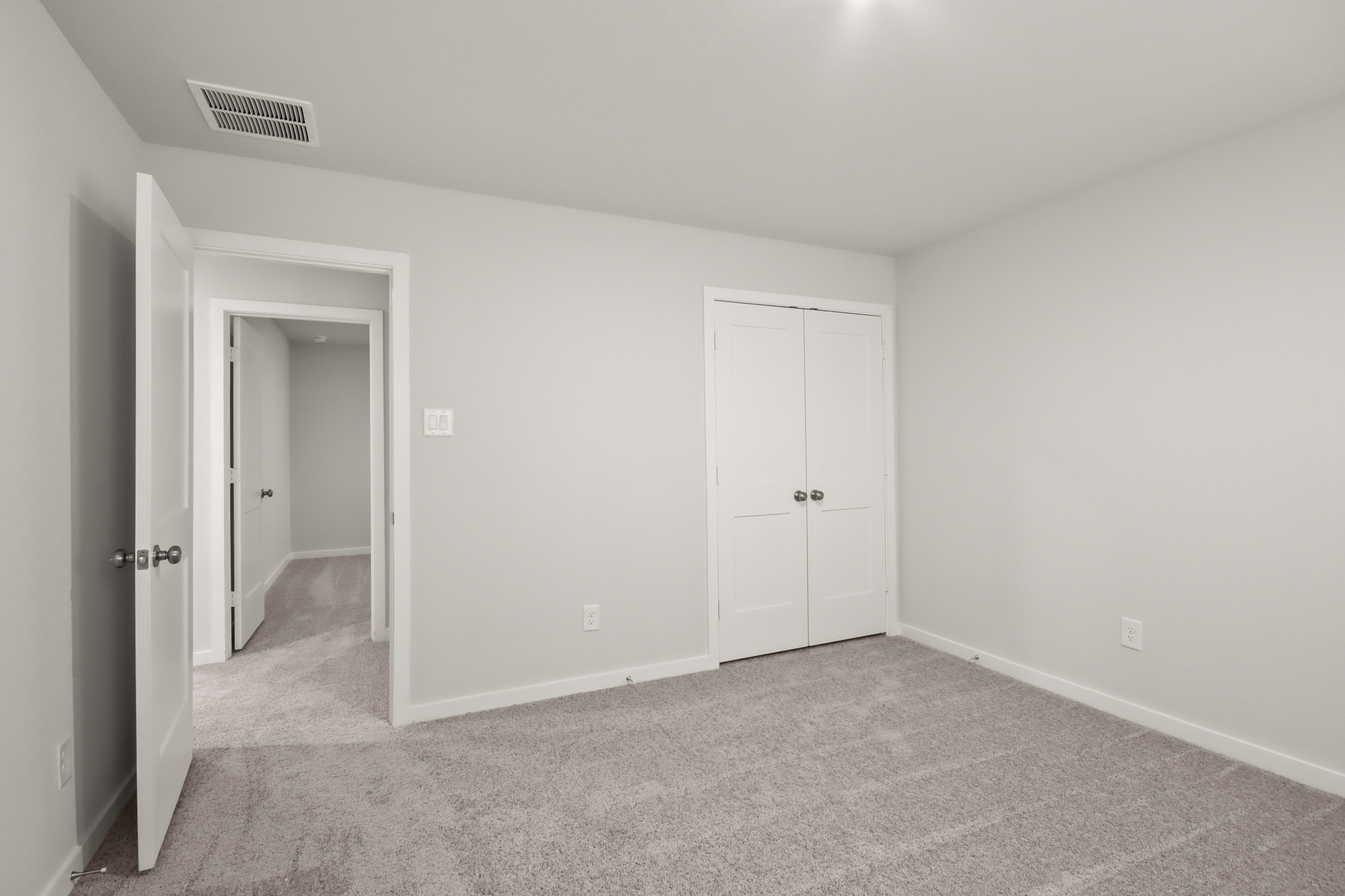 A room with white doors.