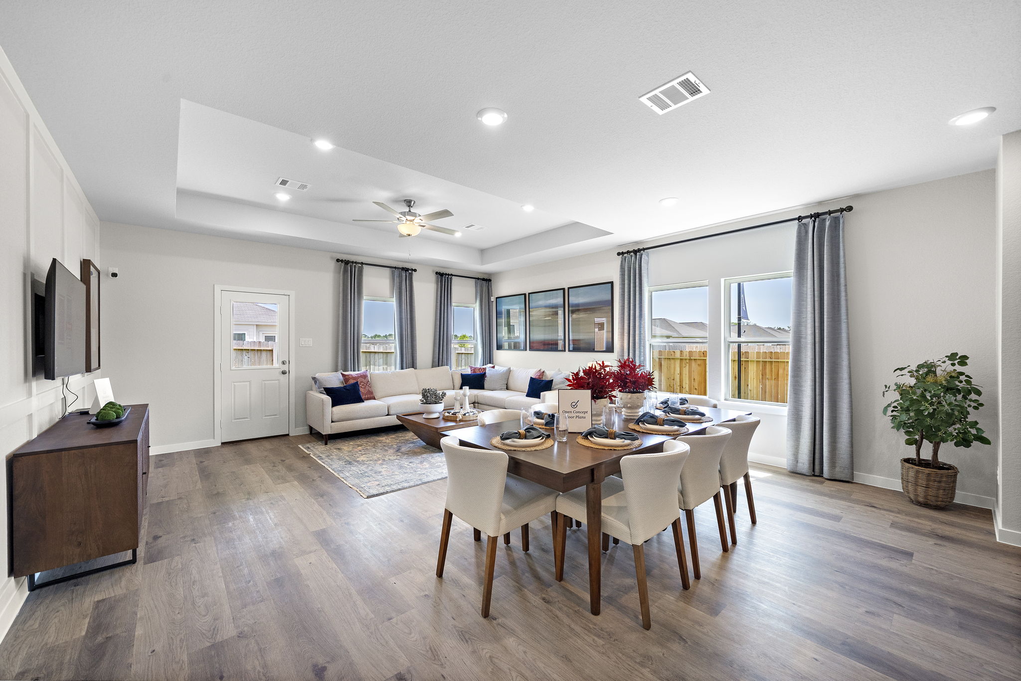 A large dining room with a large table and chairs.