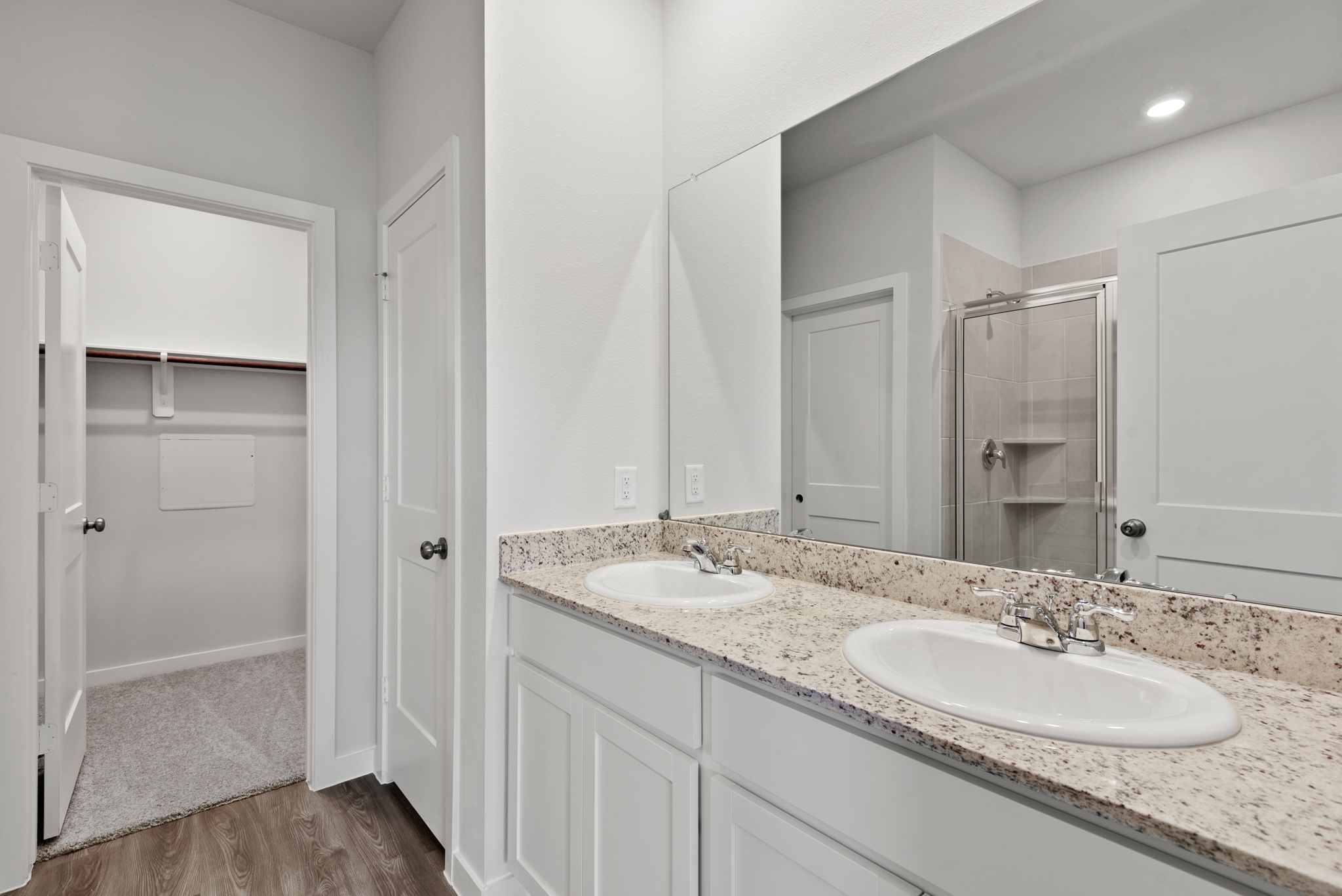 A bathroom with a marble countertop.