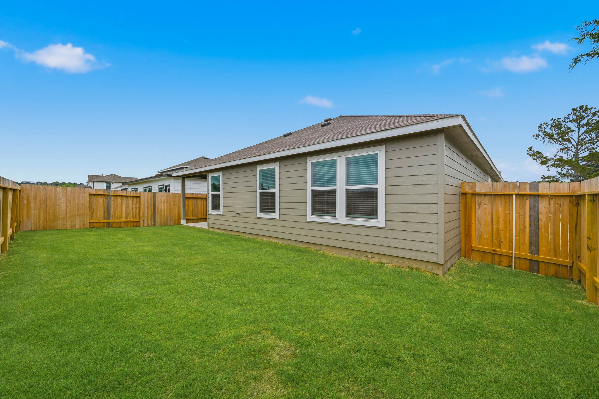 A house with a fence around it.