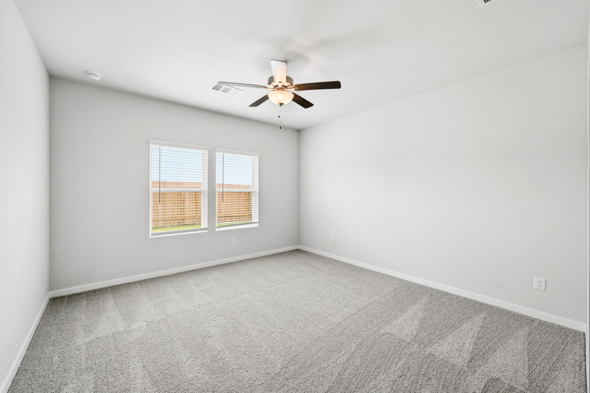 A ceiling fan in a room.