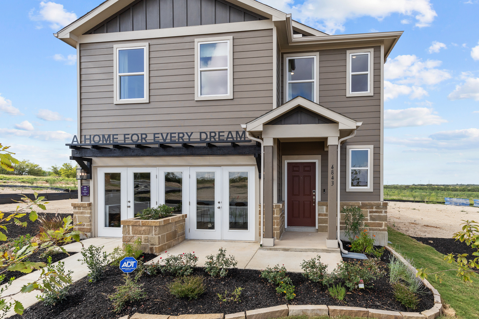 A house with a sign on the front.