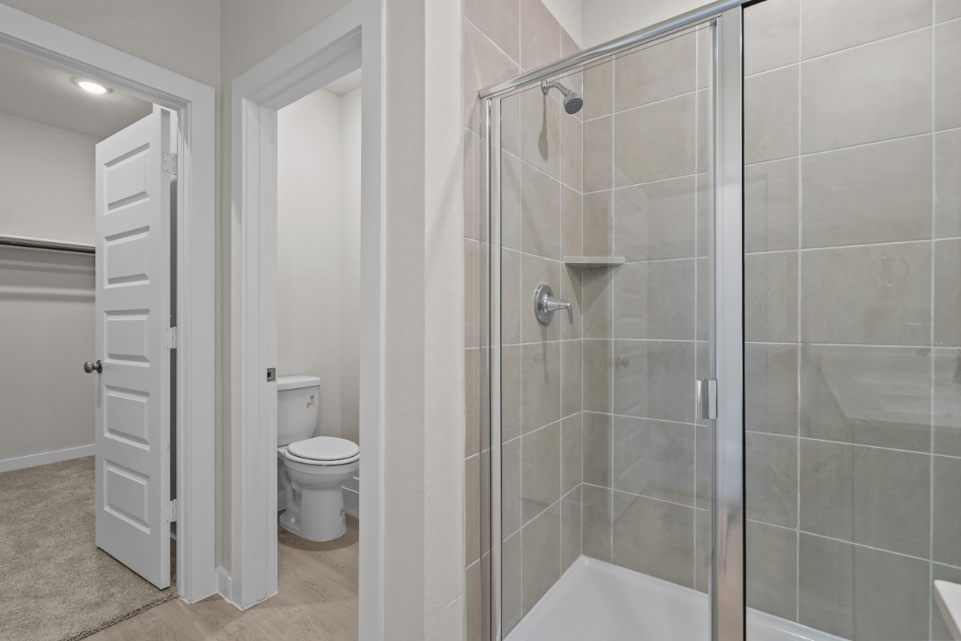 A bathroom with a glass shower.