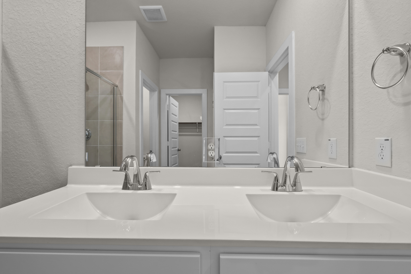 A bathroom with a couple of sinks.