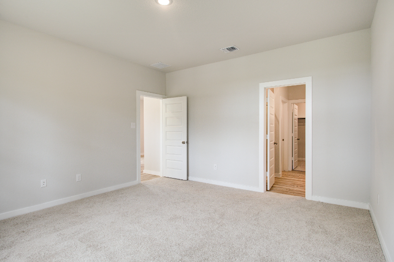 A hallway with white walls.