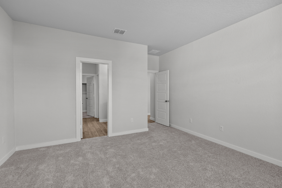 A hallway with white walls.