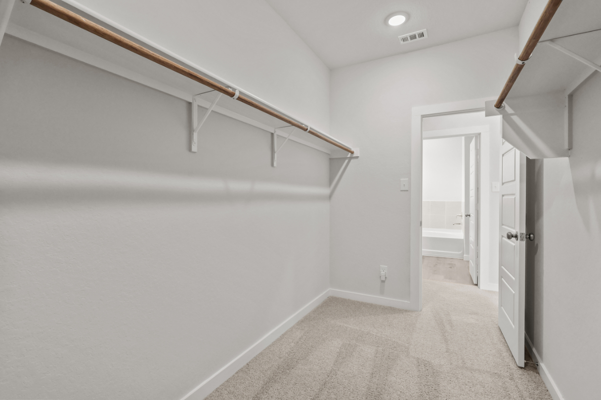 A hallway with white walls.