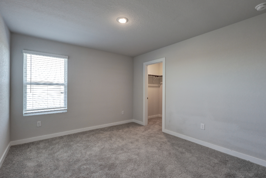 A room with a door and a window.