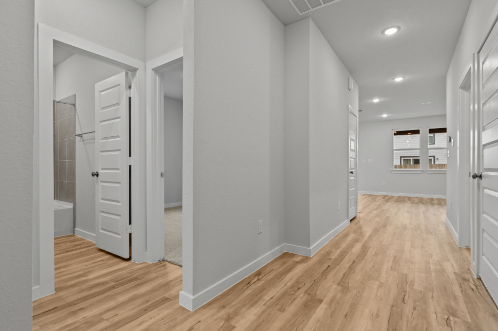 A room with white cabinets.