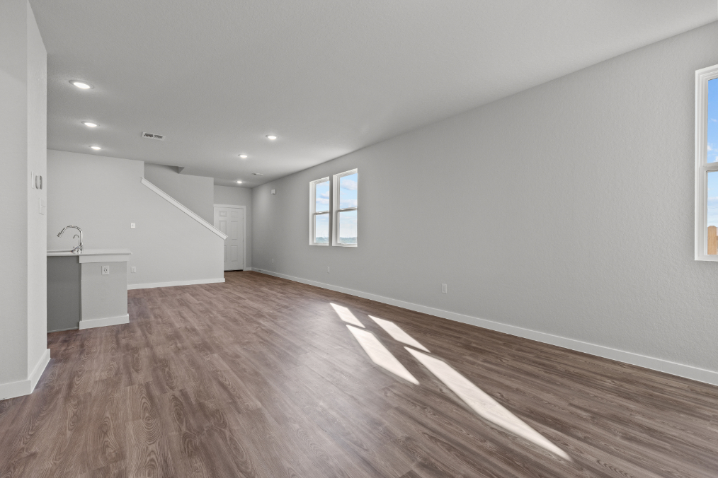 A room with a wood floor and a wood floor.