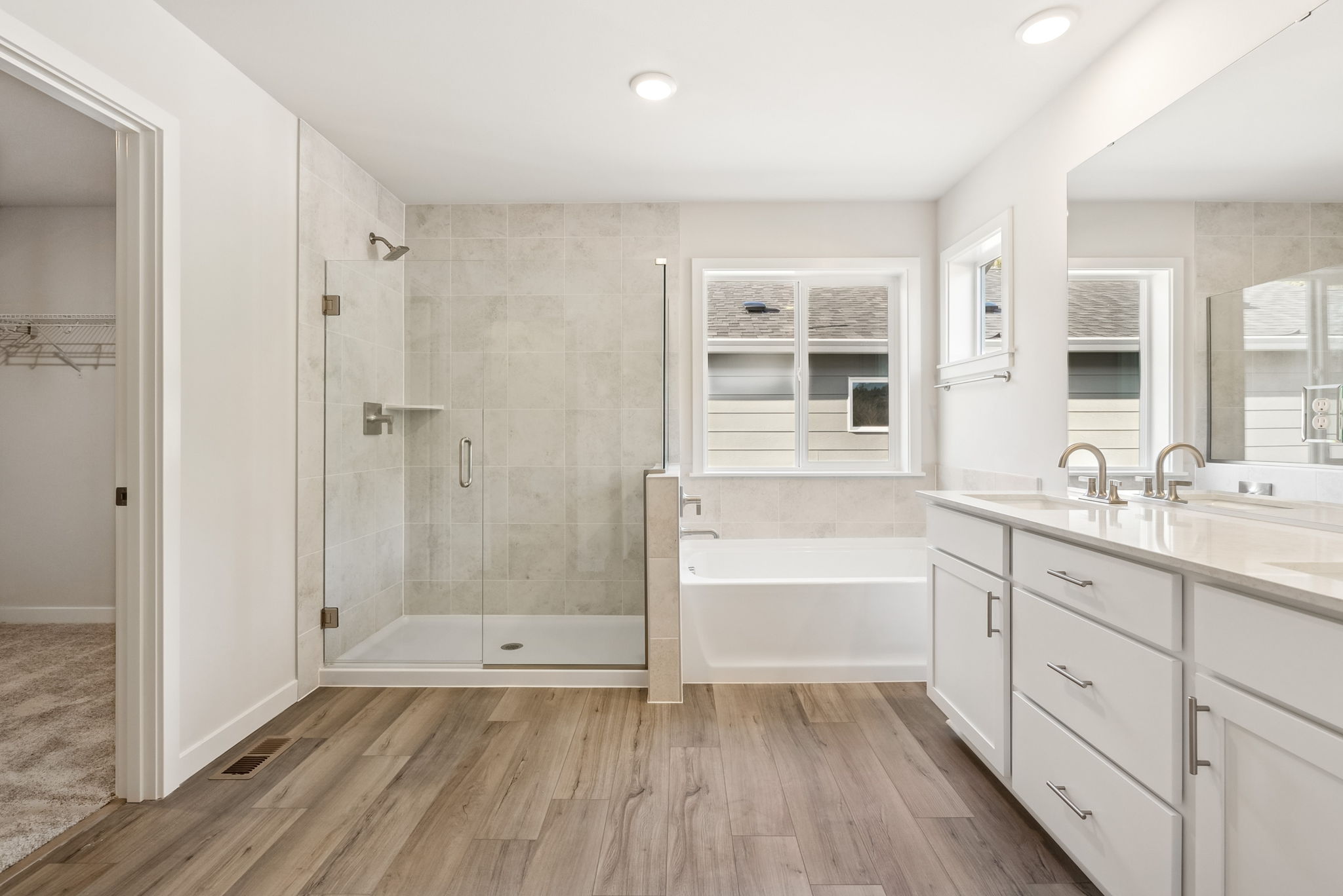 A bathroom with a tub and sink.