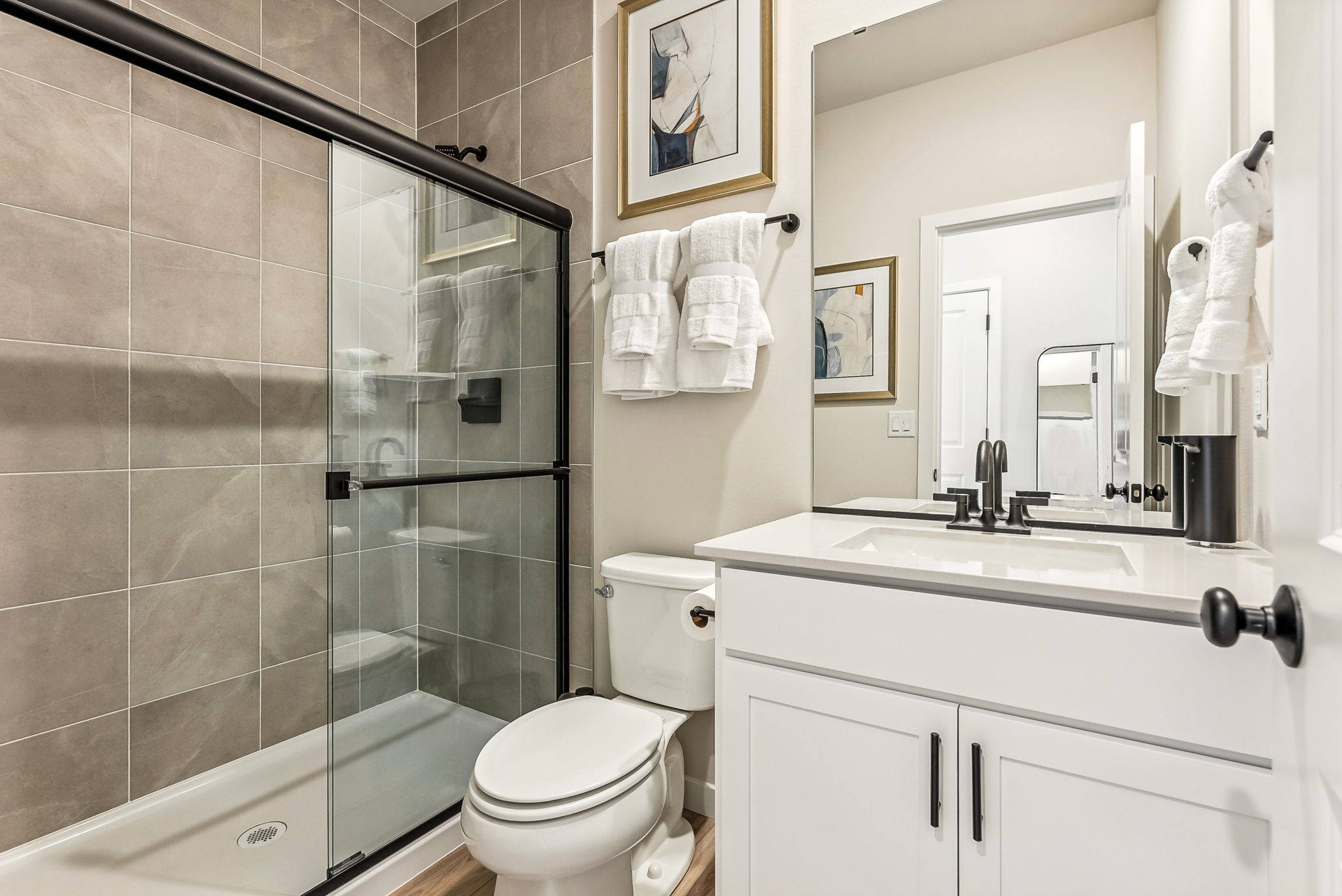 A bathroom with a glass shower.