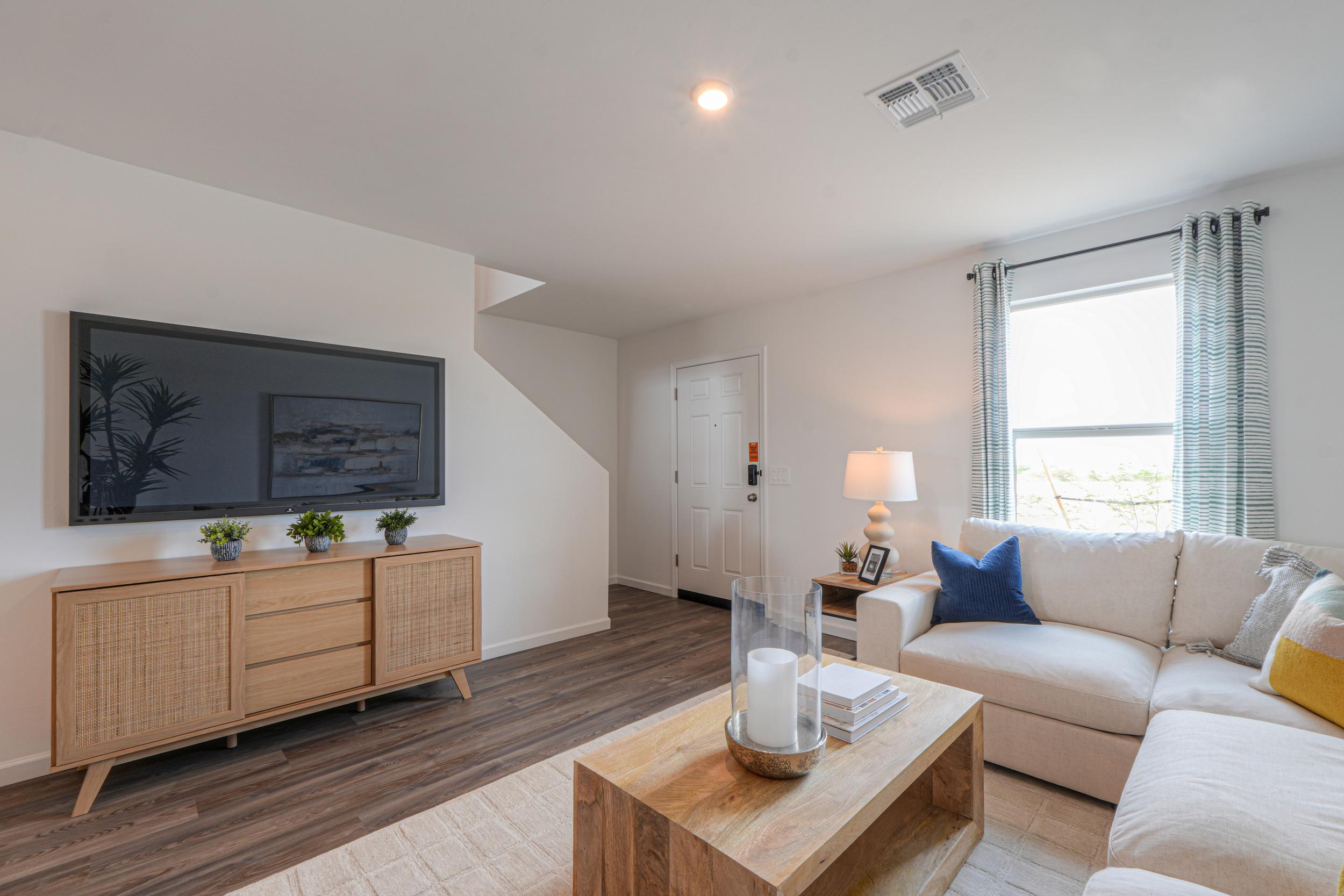 A living room with a couch and a coffee table.