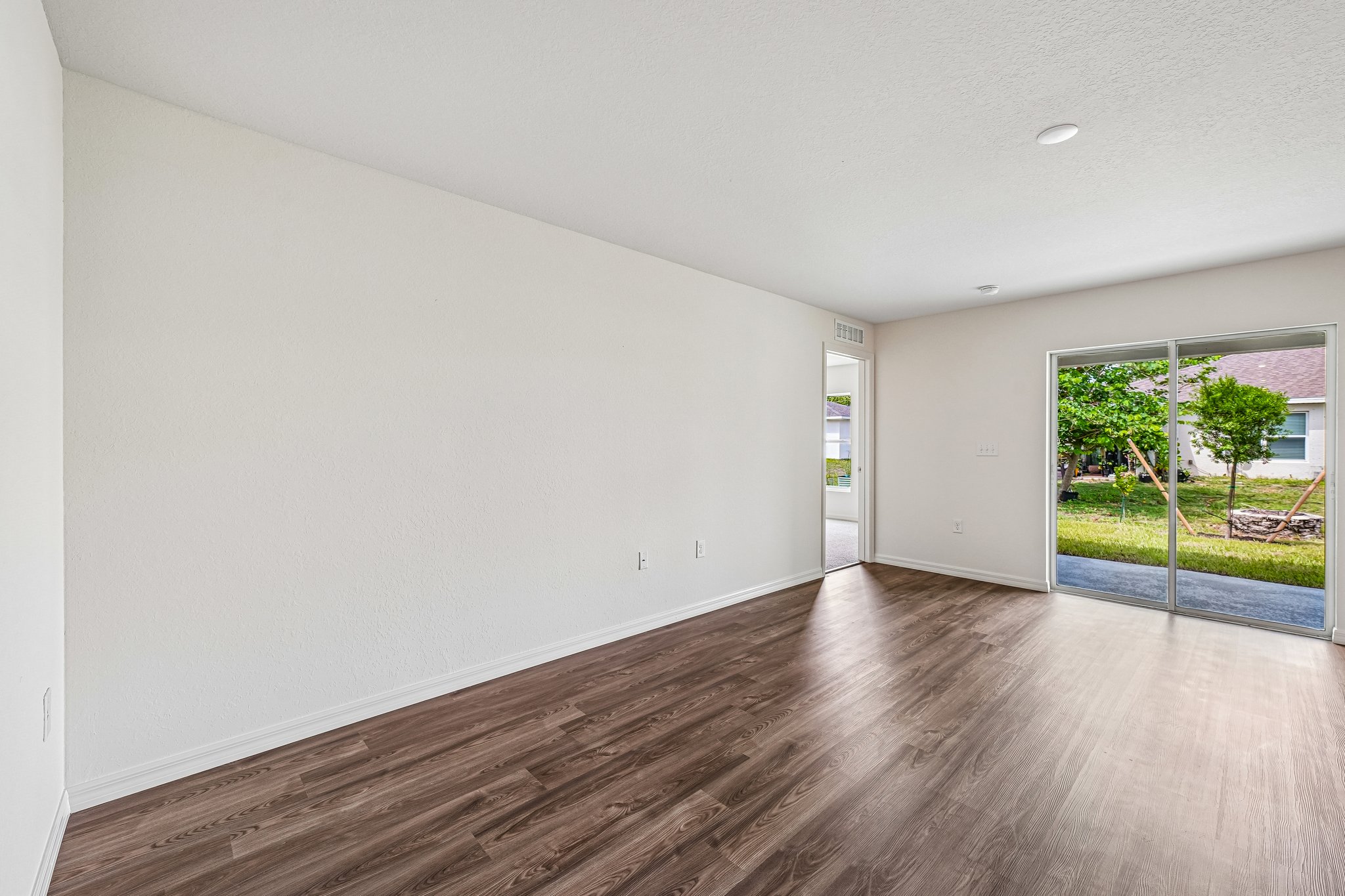 A room with a wood floor and a wood floor.