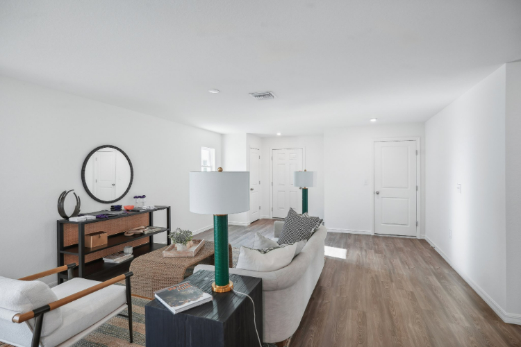 A living room with a white wall.