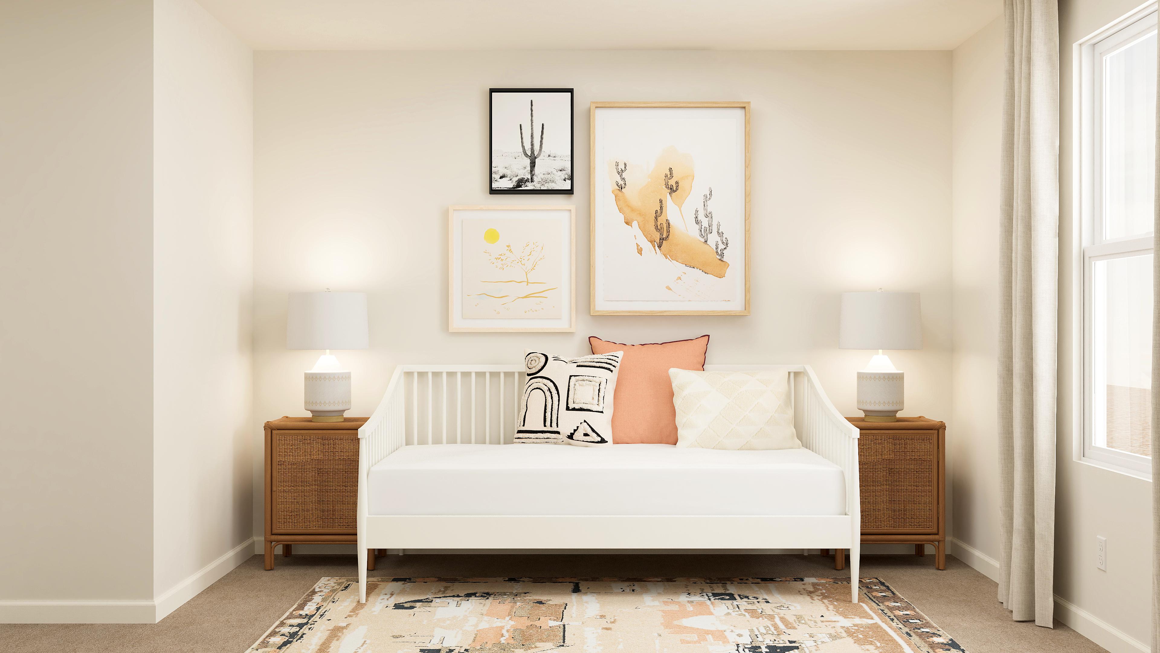 A white bed in a room.