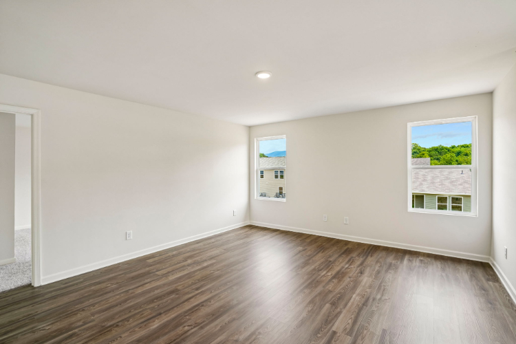 A room with a wood floor and a wood floor.