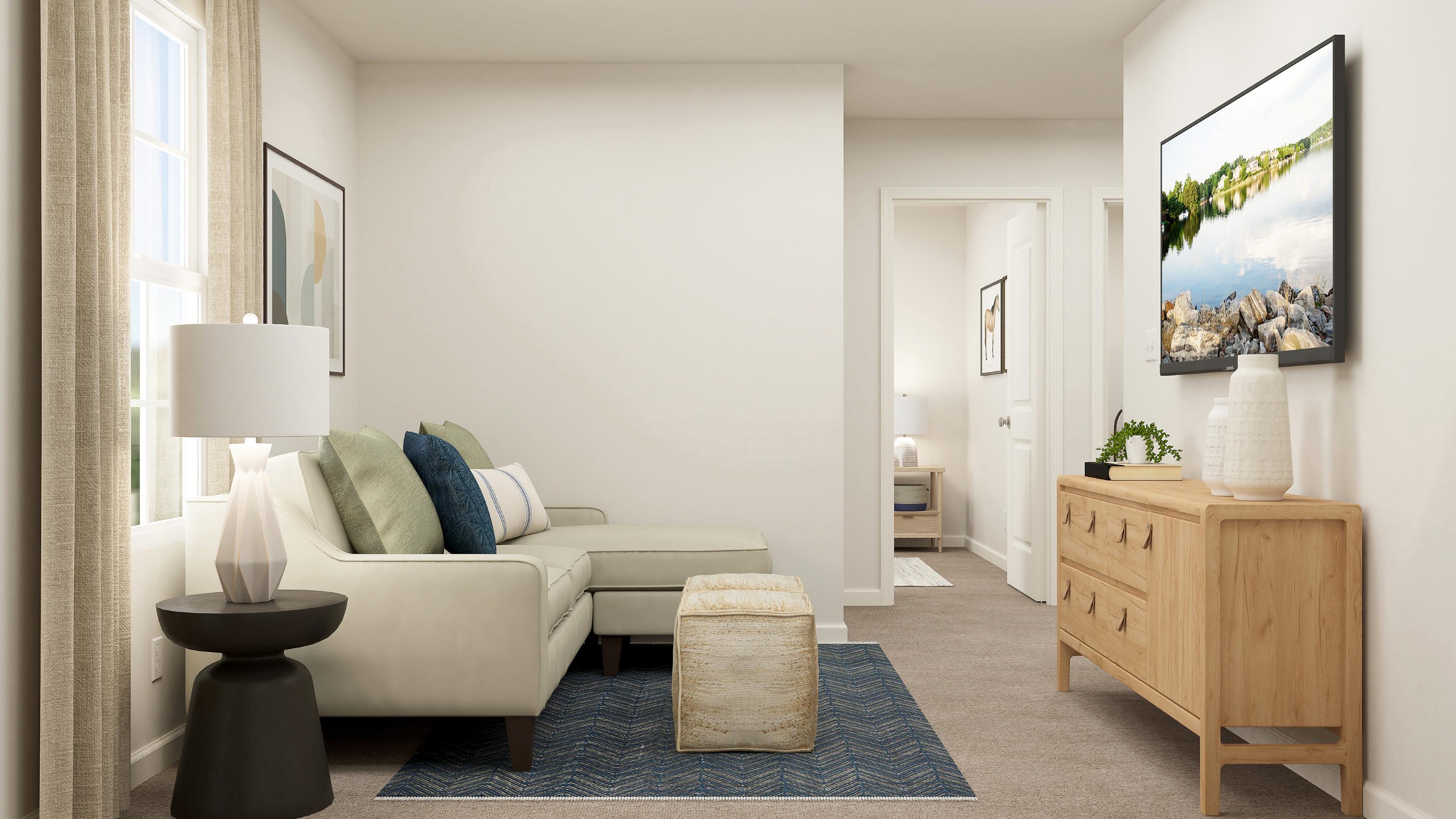 A room with a couch and a table.