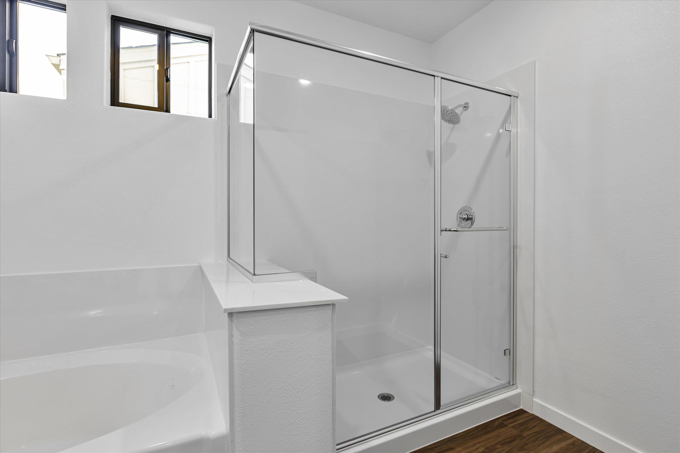 A bathroom with a glass shower.