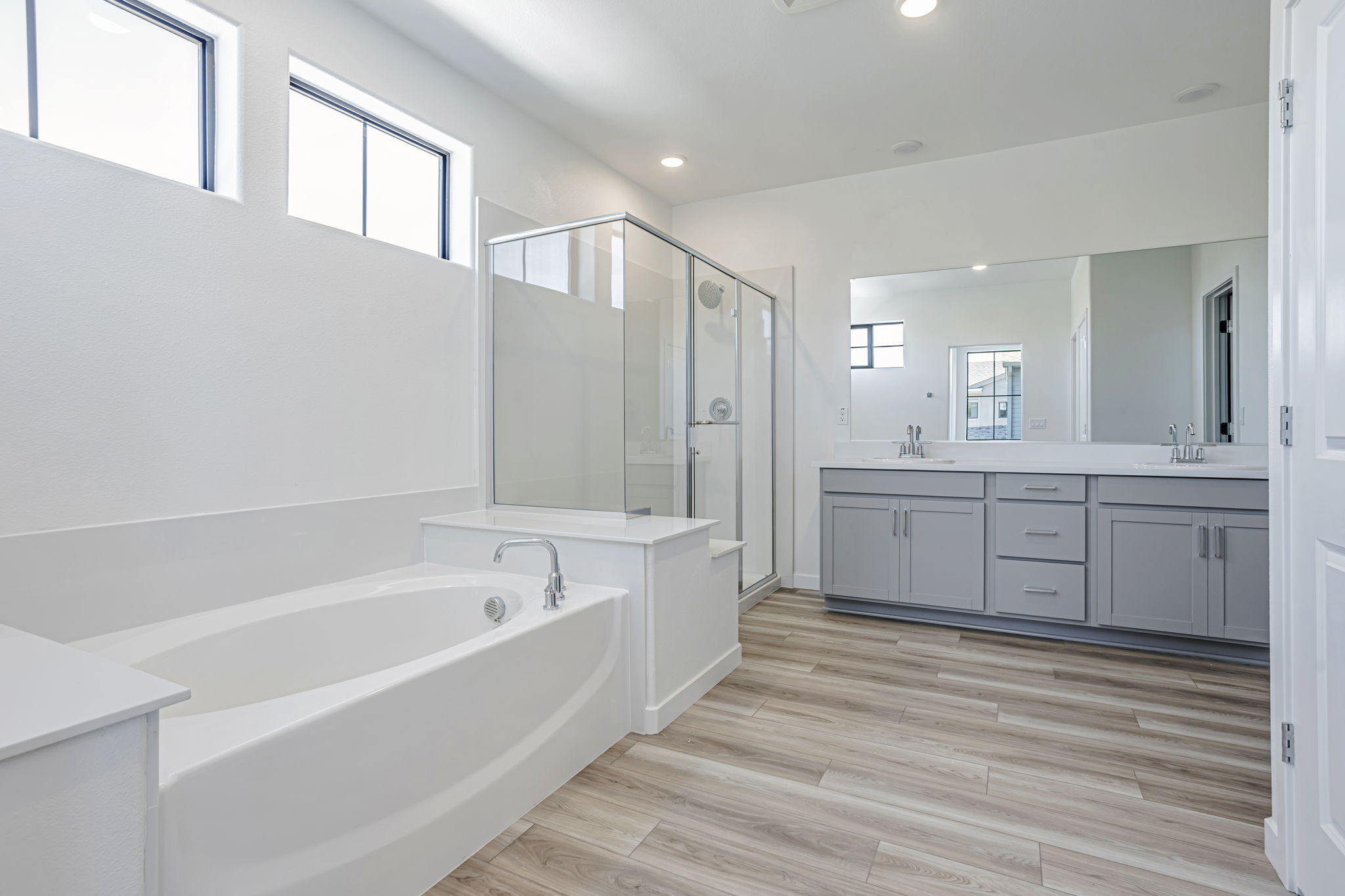 A bathroom with a tub and sink.