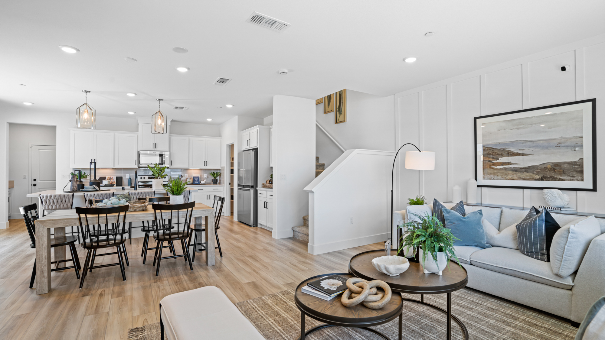 A large living room with a wood floor and a wood floor.